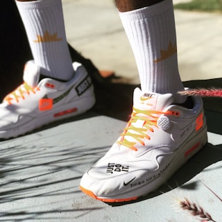 Urban street scene with a person wearing stylish Air Max sneakers.