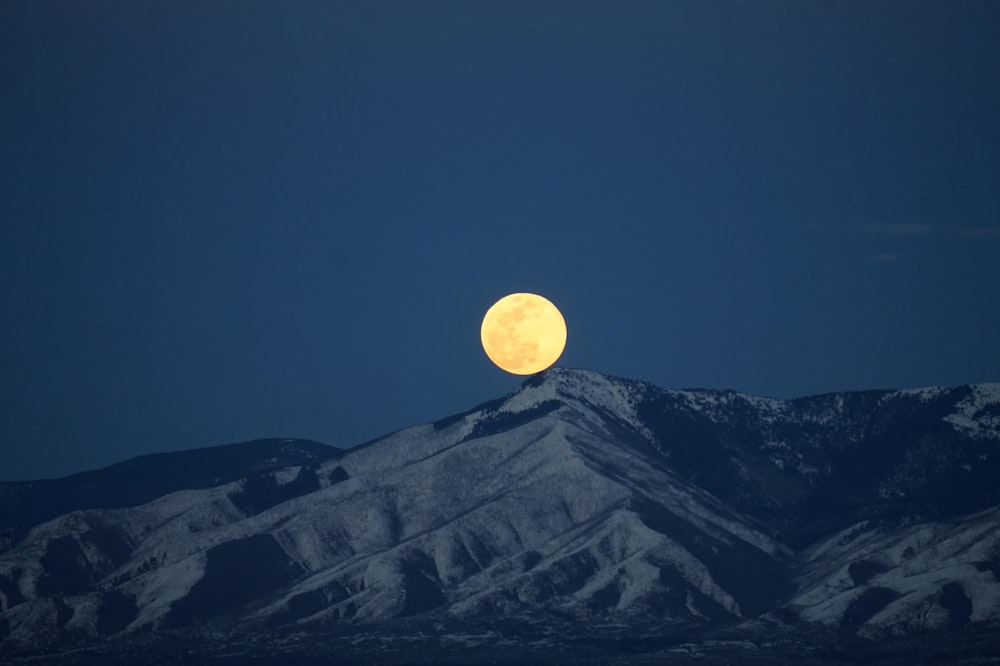 photo of moon and mountain