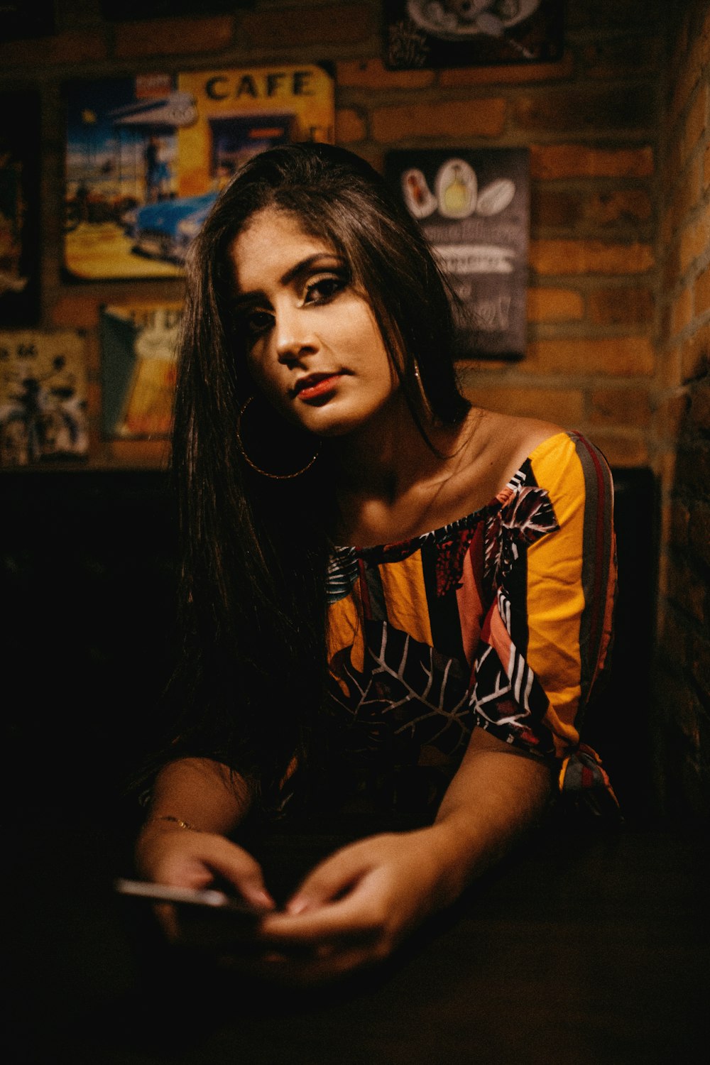 woman in orange and black off-shoulder shirt