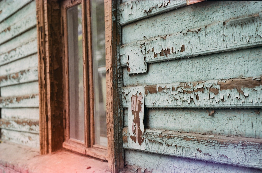 a close up of a window on a wooden building