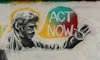 Grafiti art of man, including speech bubble expressing the words, “ACT NOW”.