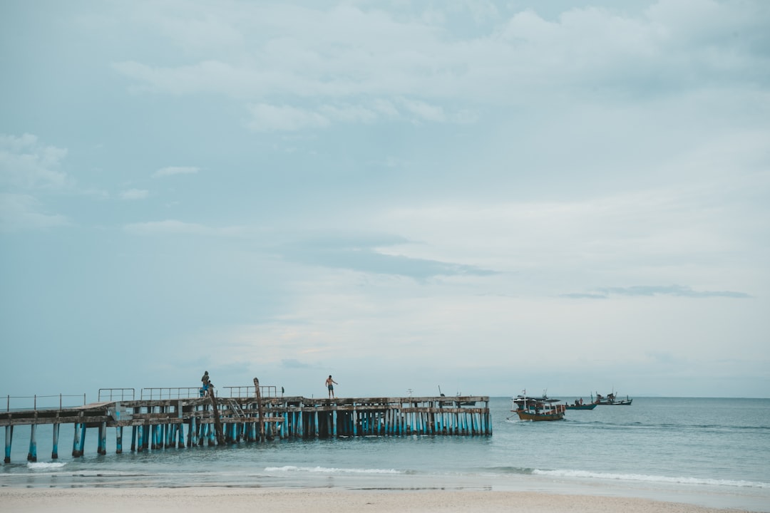 blue and gray dock under gray sky