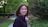 smiling woman wearing black collared blouse