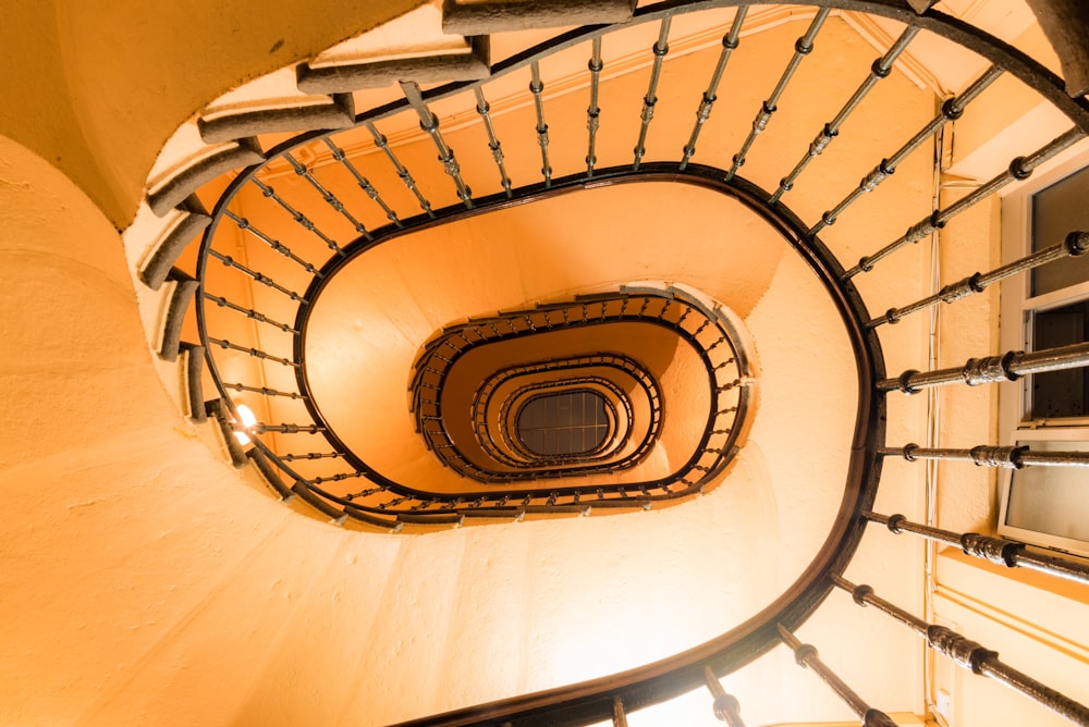 high-angle photography of curved stairs