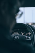 Close-up of a truck dashboard showing an electronic logging device in use.