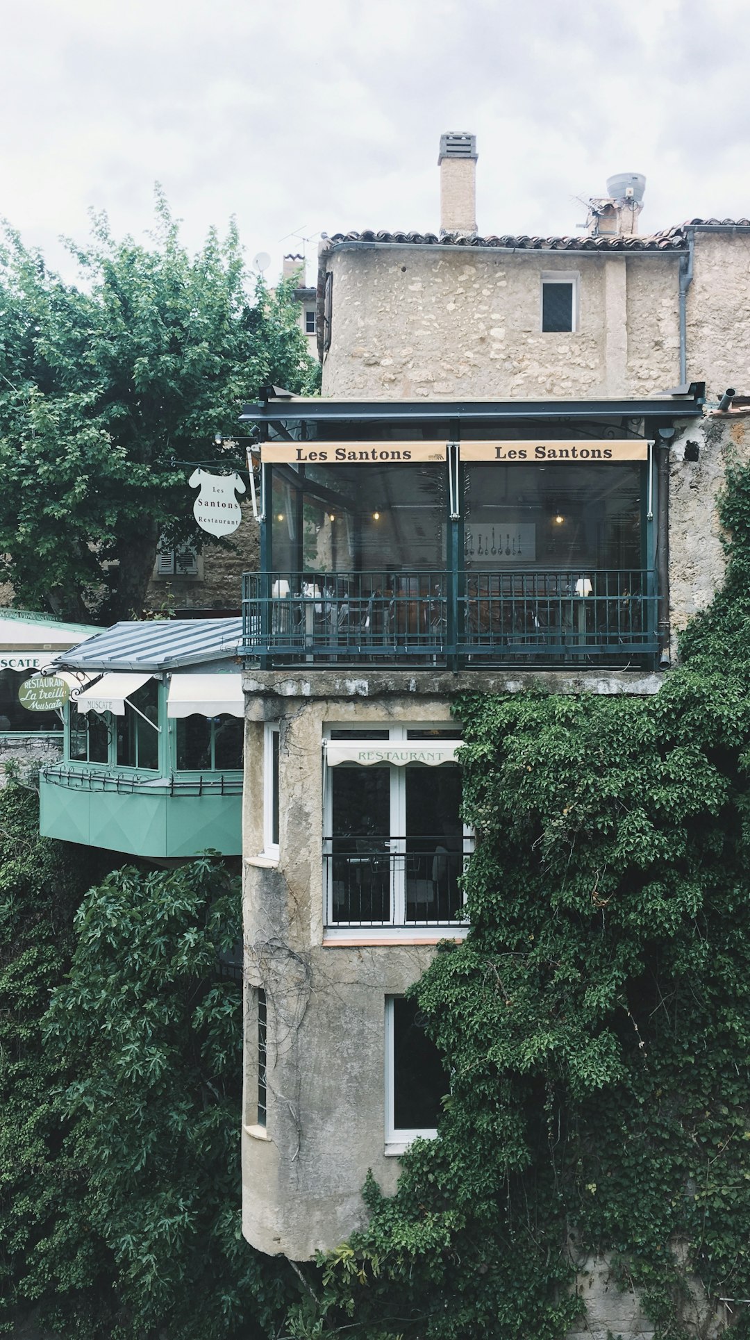 grey building by the cliff