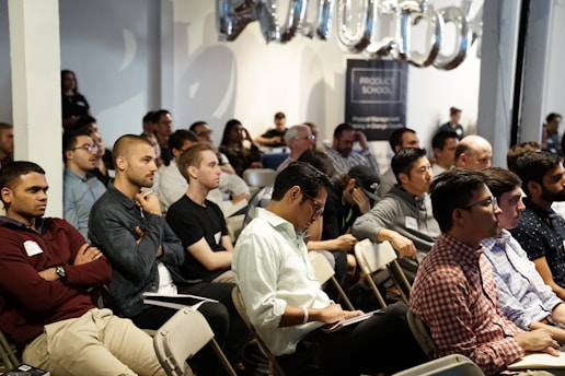 people inside white room attending a conference