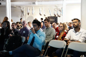 group of people inside white room
