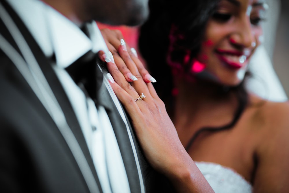 woman resting her hands on man's chest