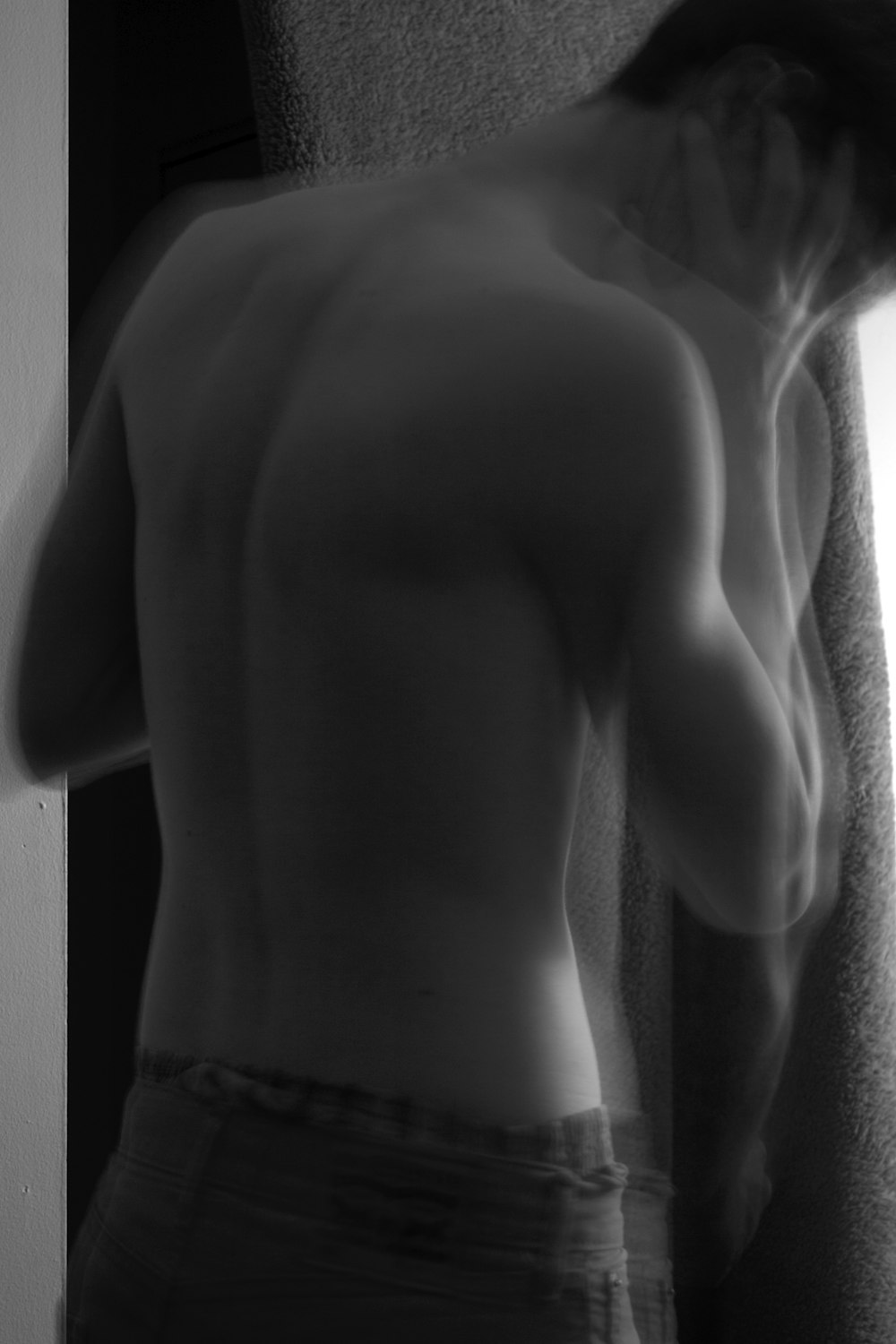 grayscale photo of person wearing bottoms