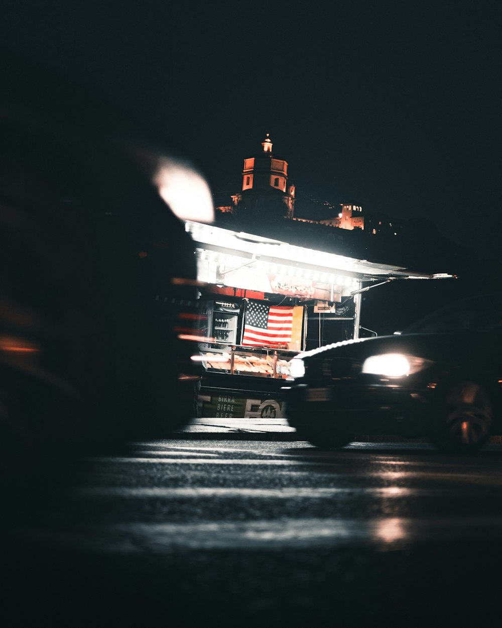 cars traveling on street at night