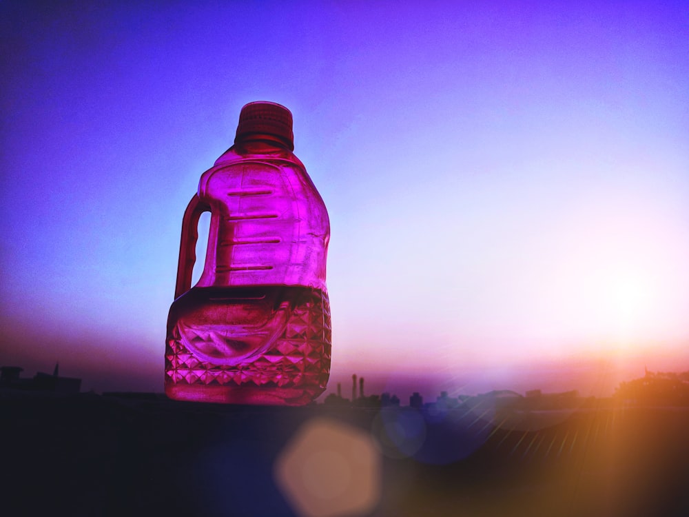 pink plastic bottle jug on platform