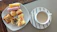Close-up of a beautifully arranged cheese platter paired with a steaming cup of coffee.