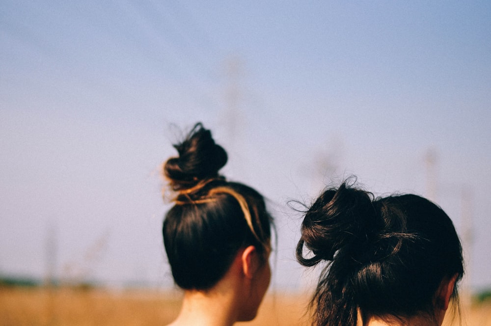 a couple of women standing next to each other