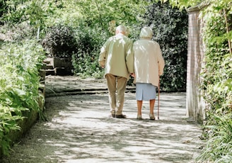 man and woman walking on road during daytime