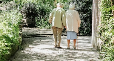 man and woman walking on road during daytime