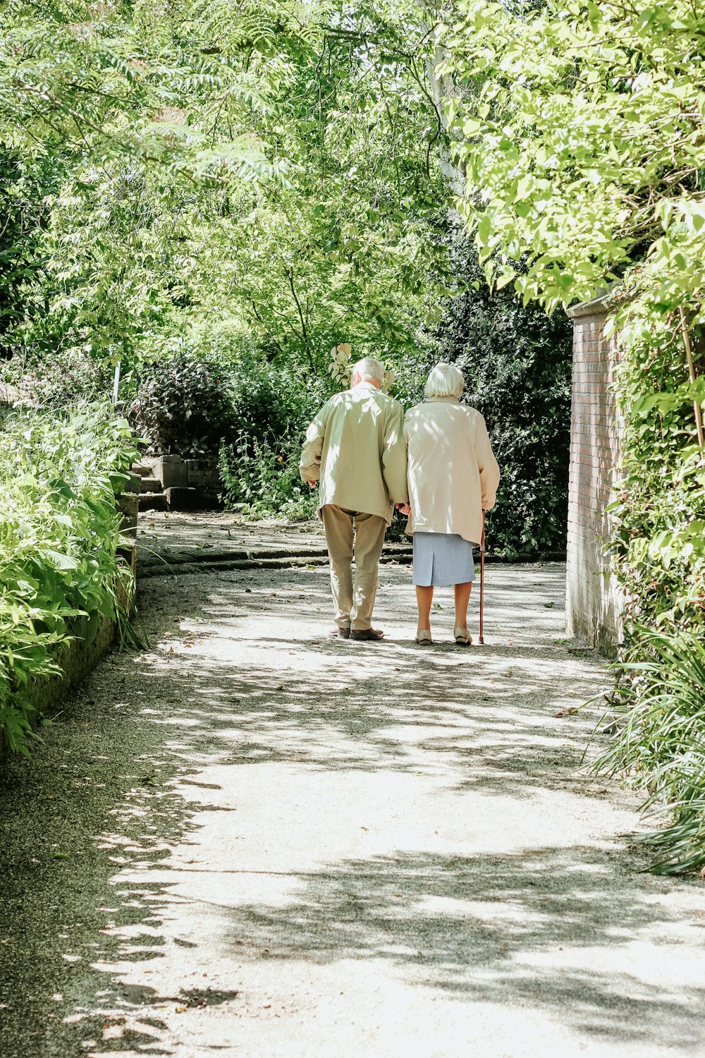 man and woman walking on road during daytime