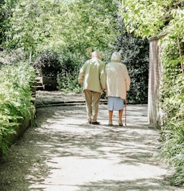 man and woman walking on road during daytime