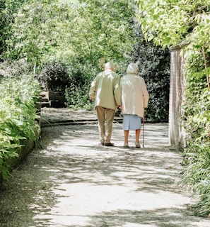 man and woman walking on road during daytime