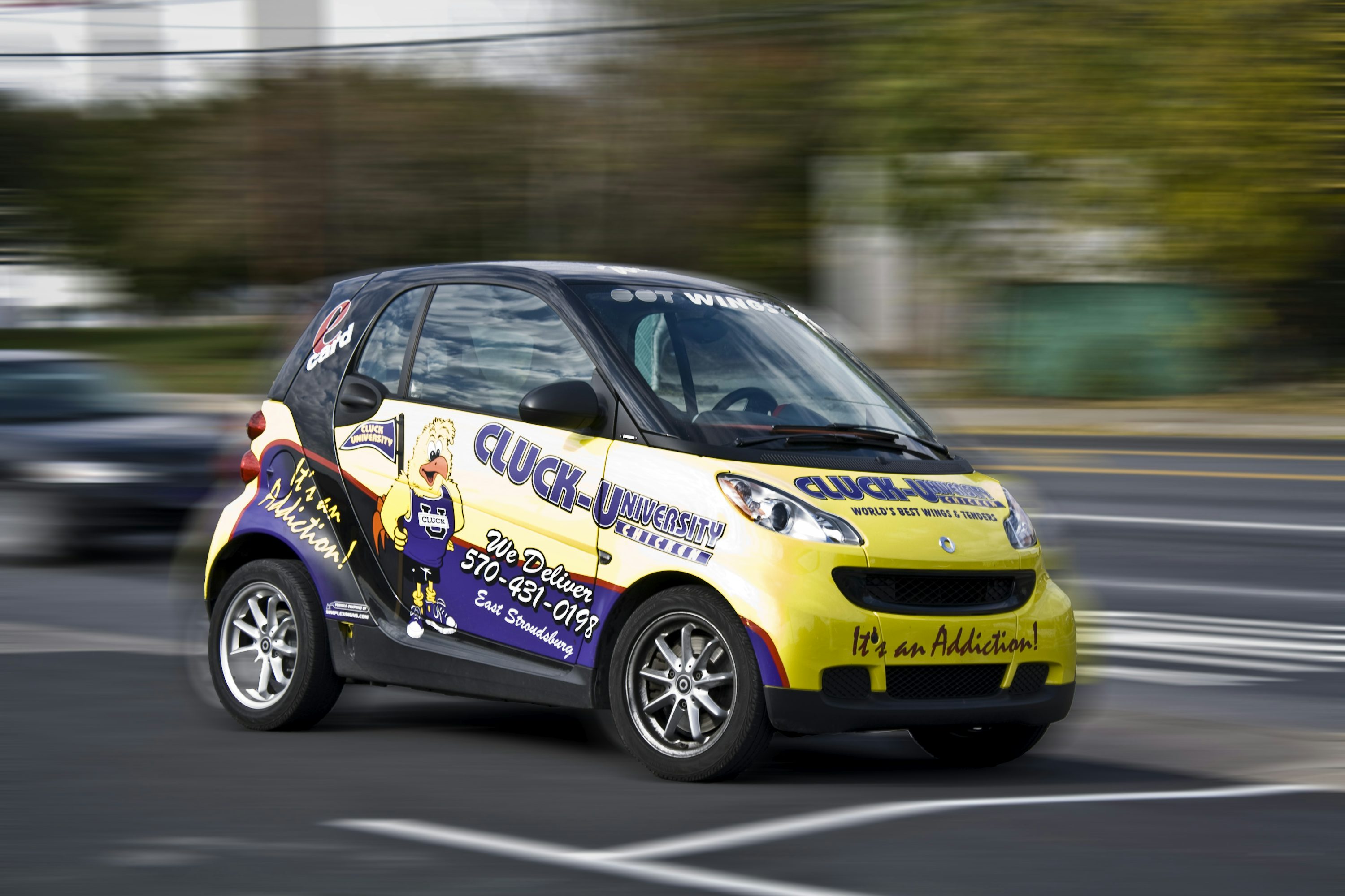 blue and yellow Smart car