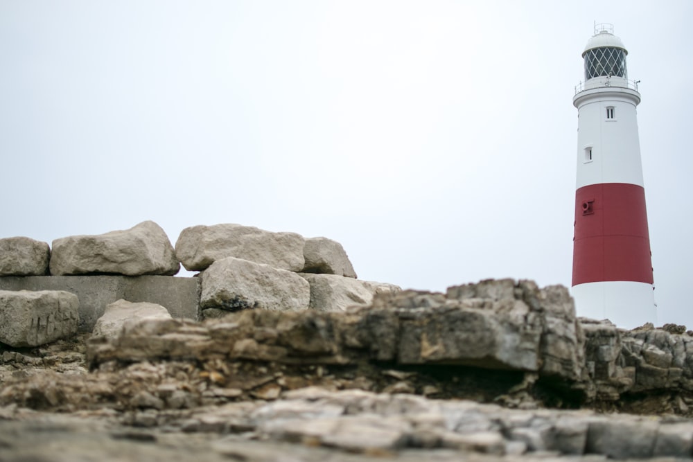 white and red striped lighthouse during daytime