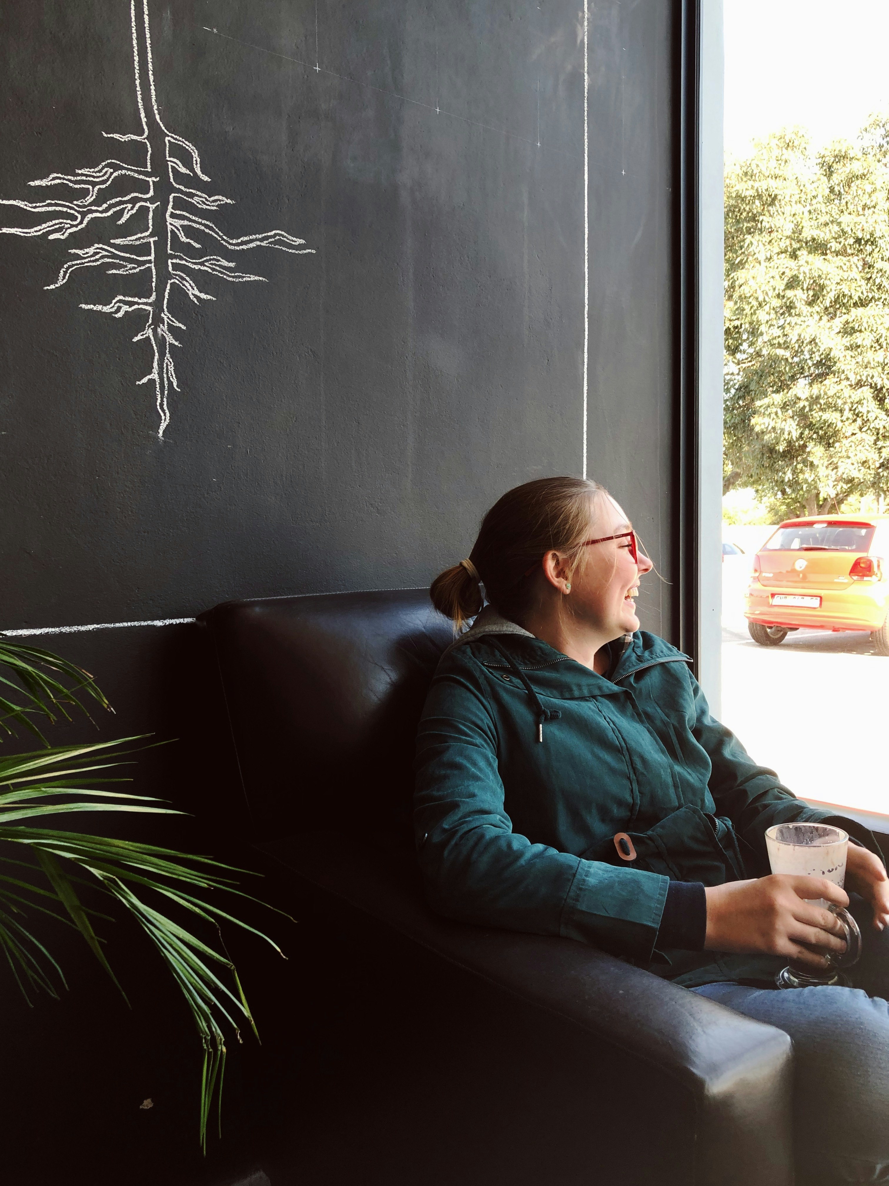 woman sitting on sofa chair