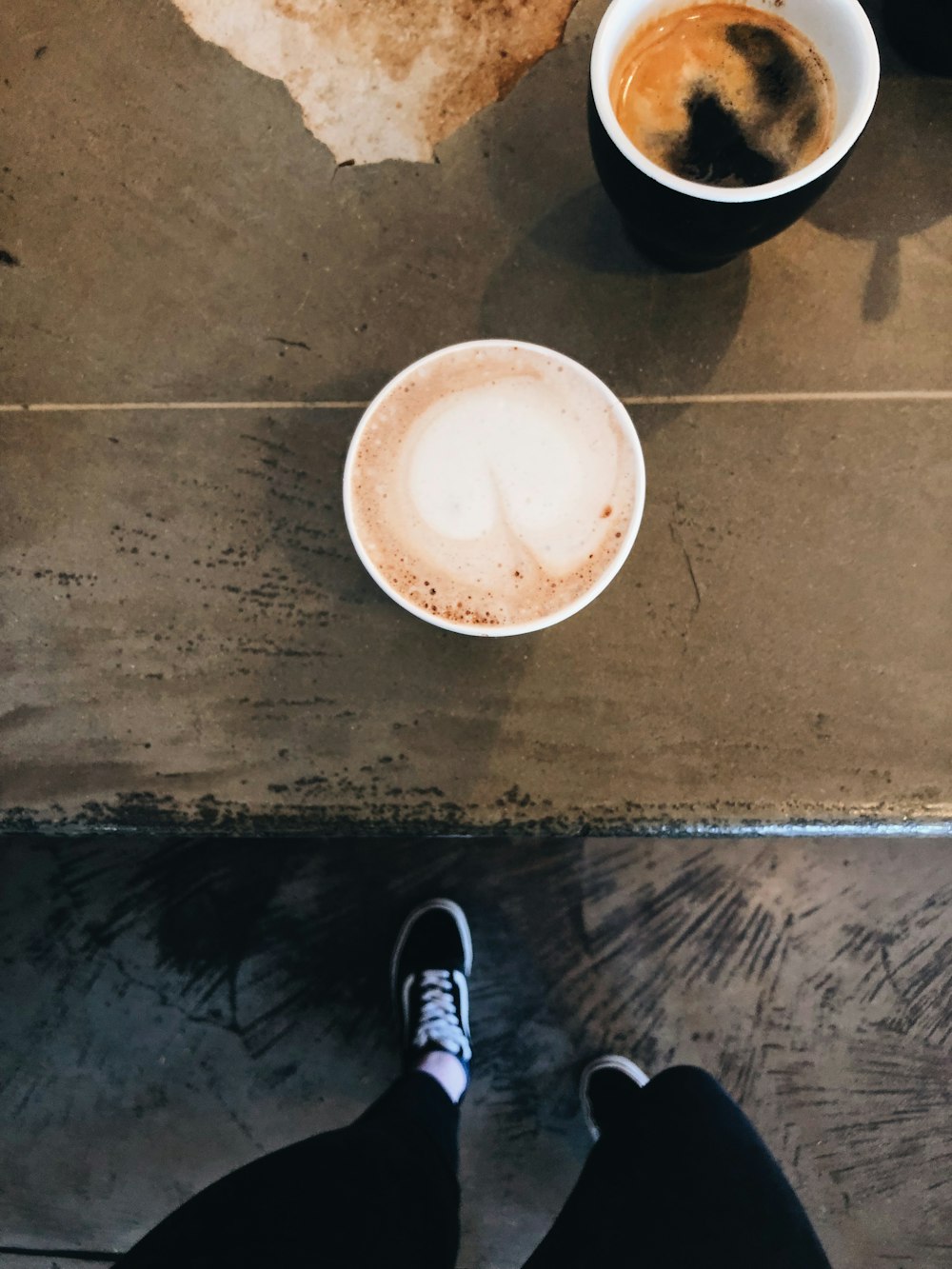 person standing on brown wooden table