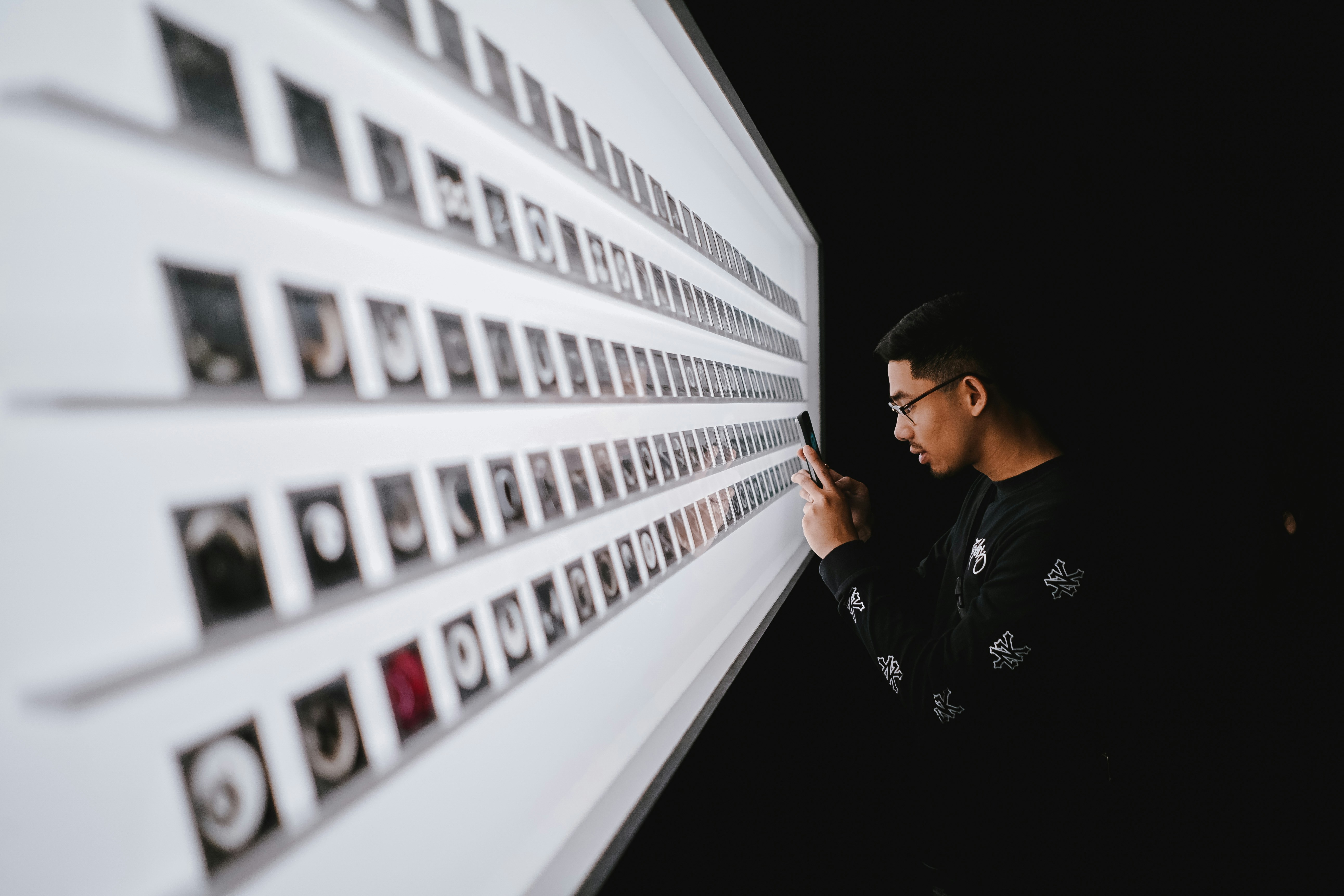 standing man while using smartphone, 