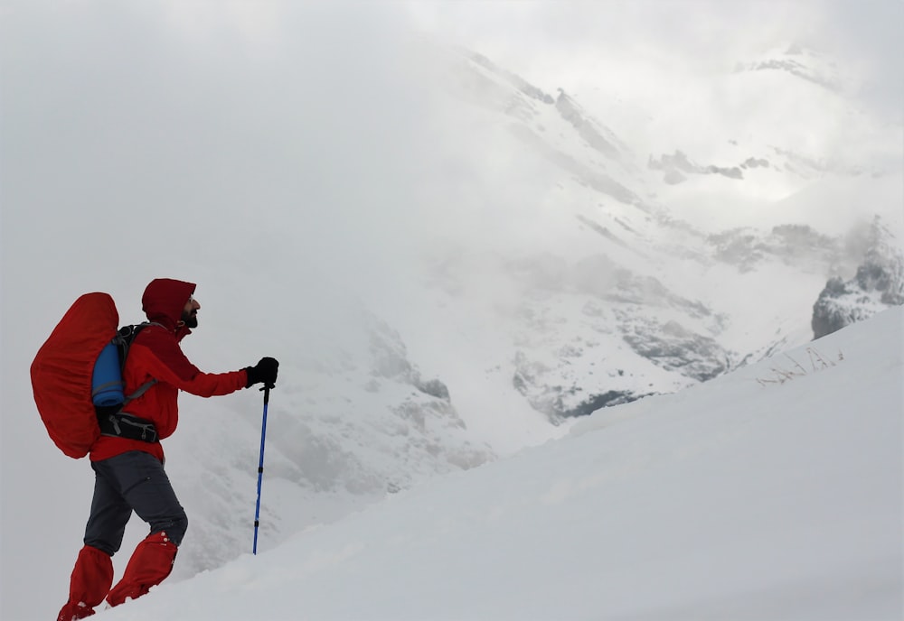 man standing on snow covered ground