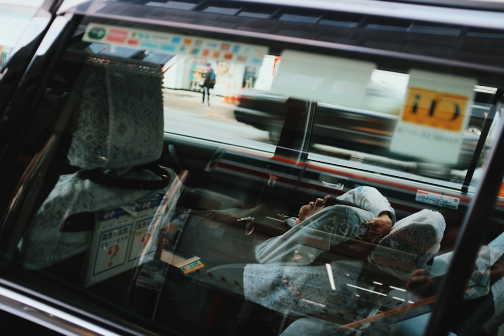 person inside car sleeping