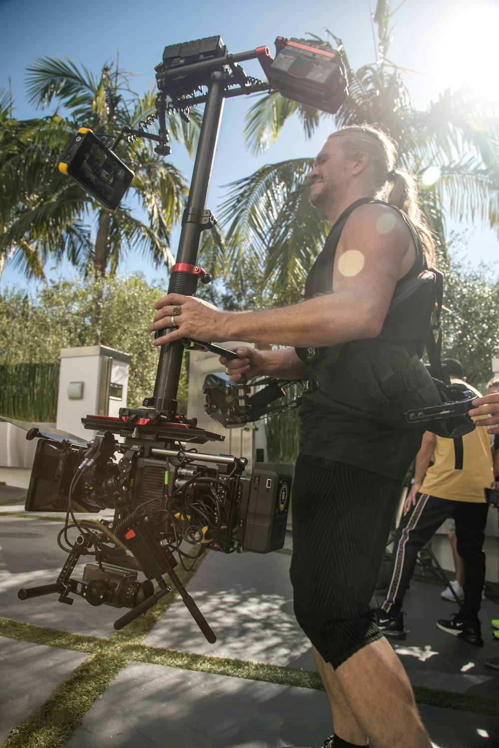 man carrying camera stabilizer