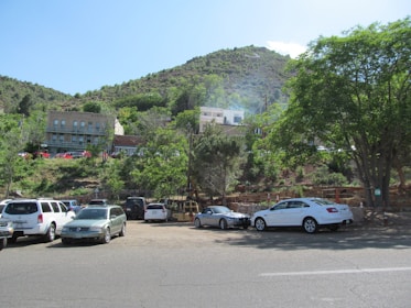 A diverse lineup of used cars parked in a sunny outdoor lot.