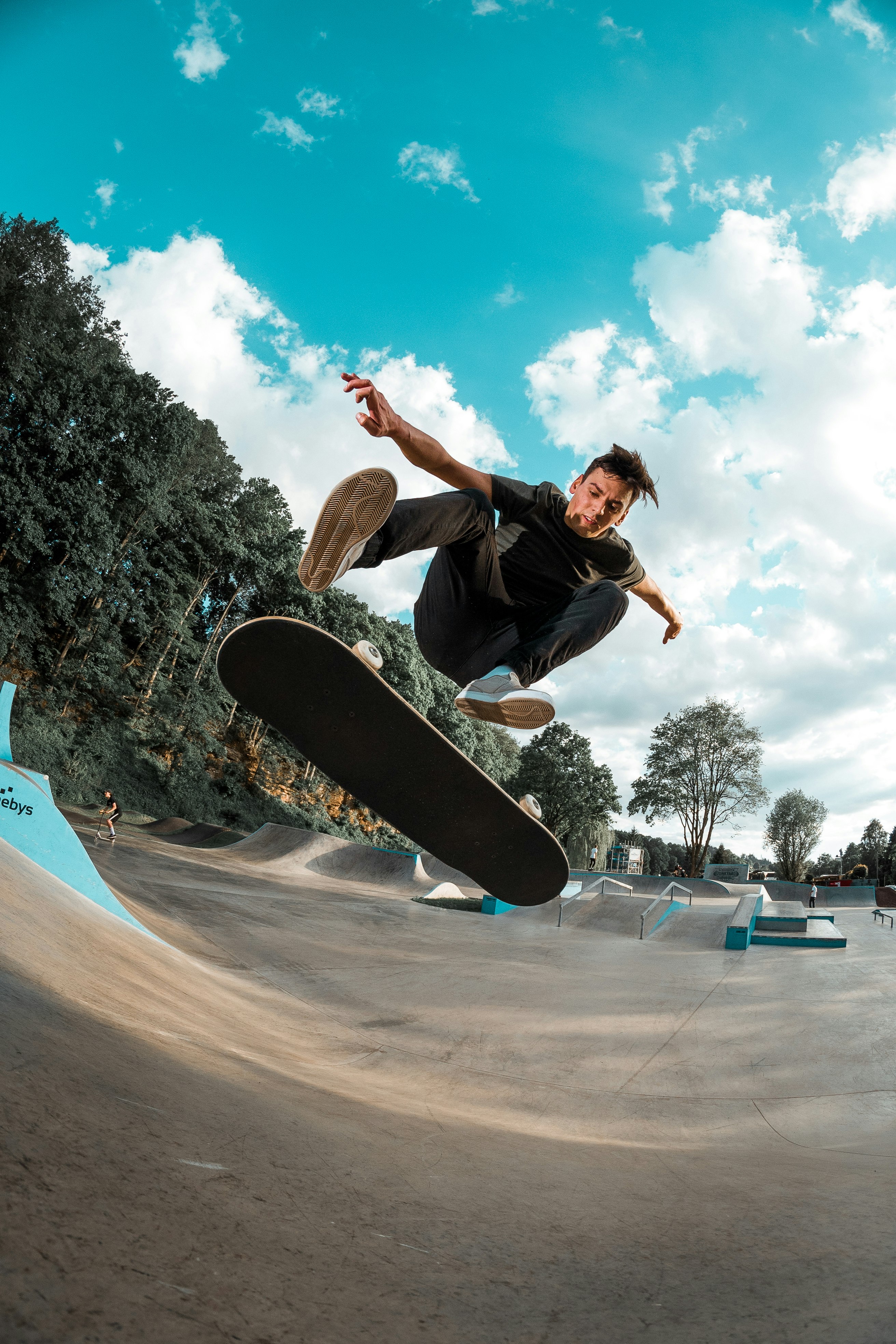 Skateboarder (Karel Hospodka) doing a kick flip
