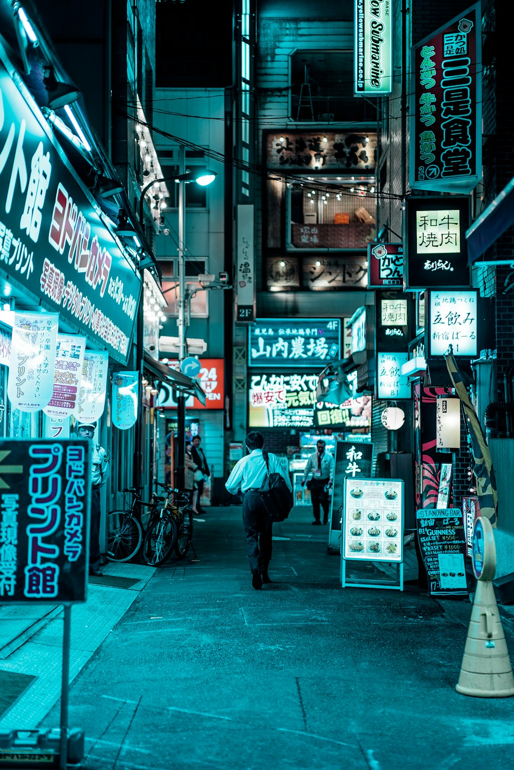 man walking at middle of street