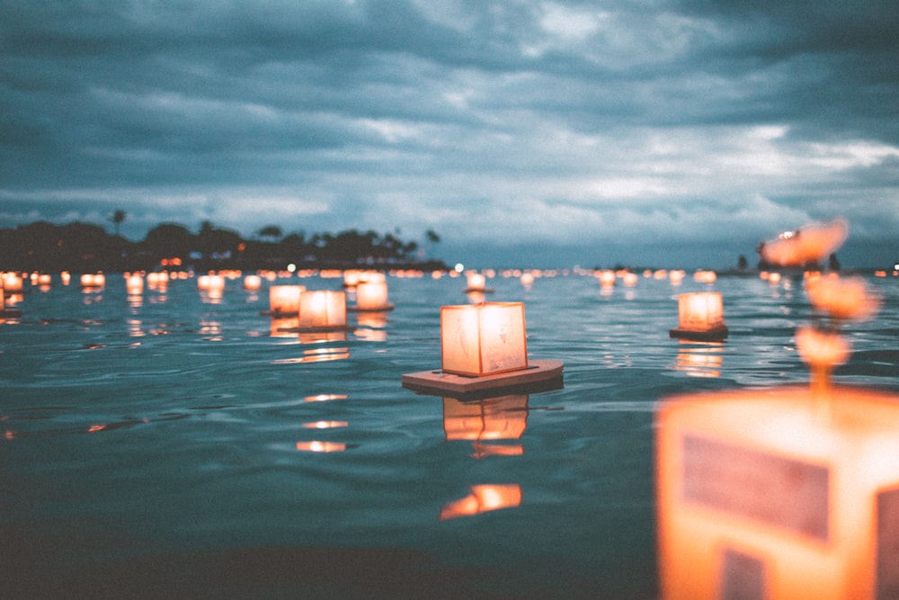 floating candles on body of water