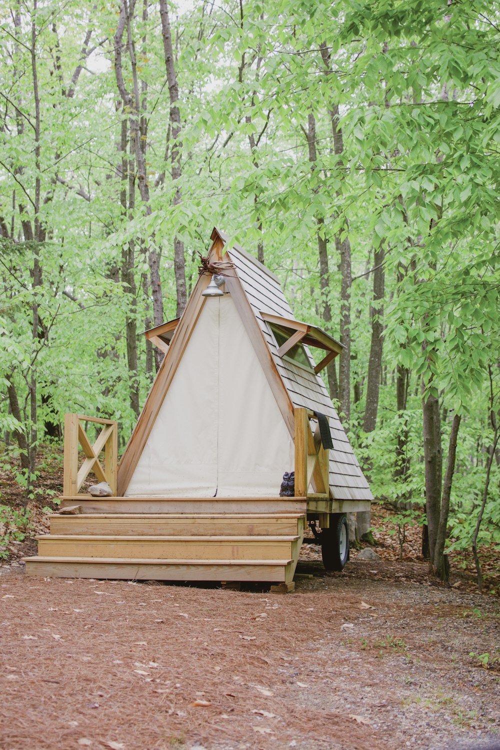 beige wooden shed beside trees