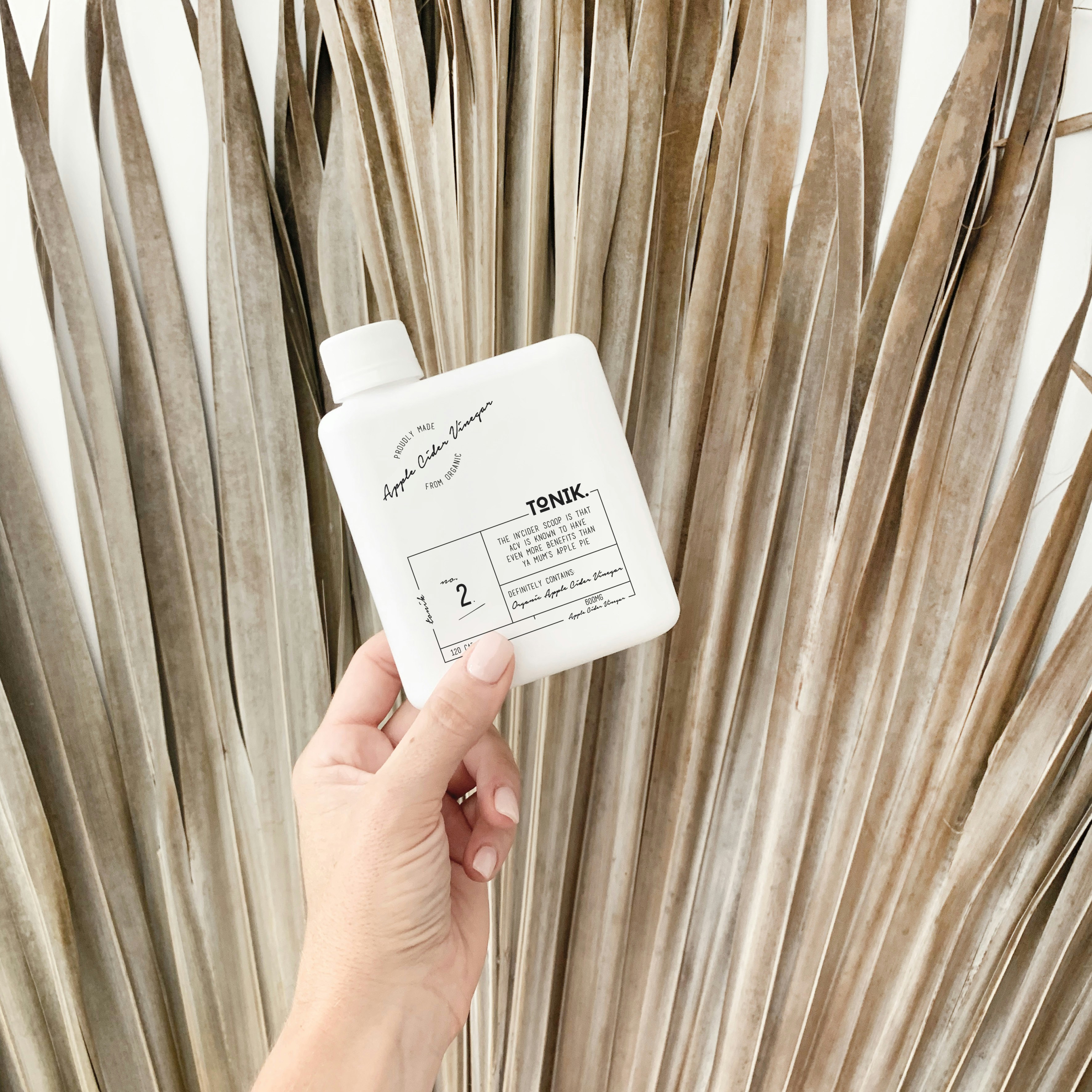 white and black labeled bottle