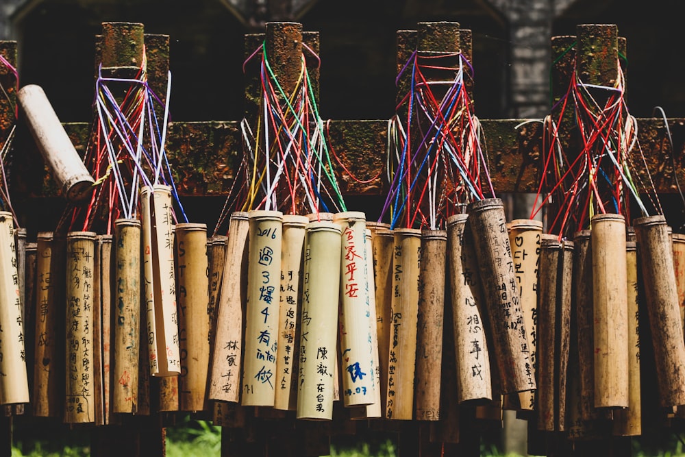 assorted bamboo containers hanging on wall