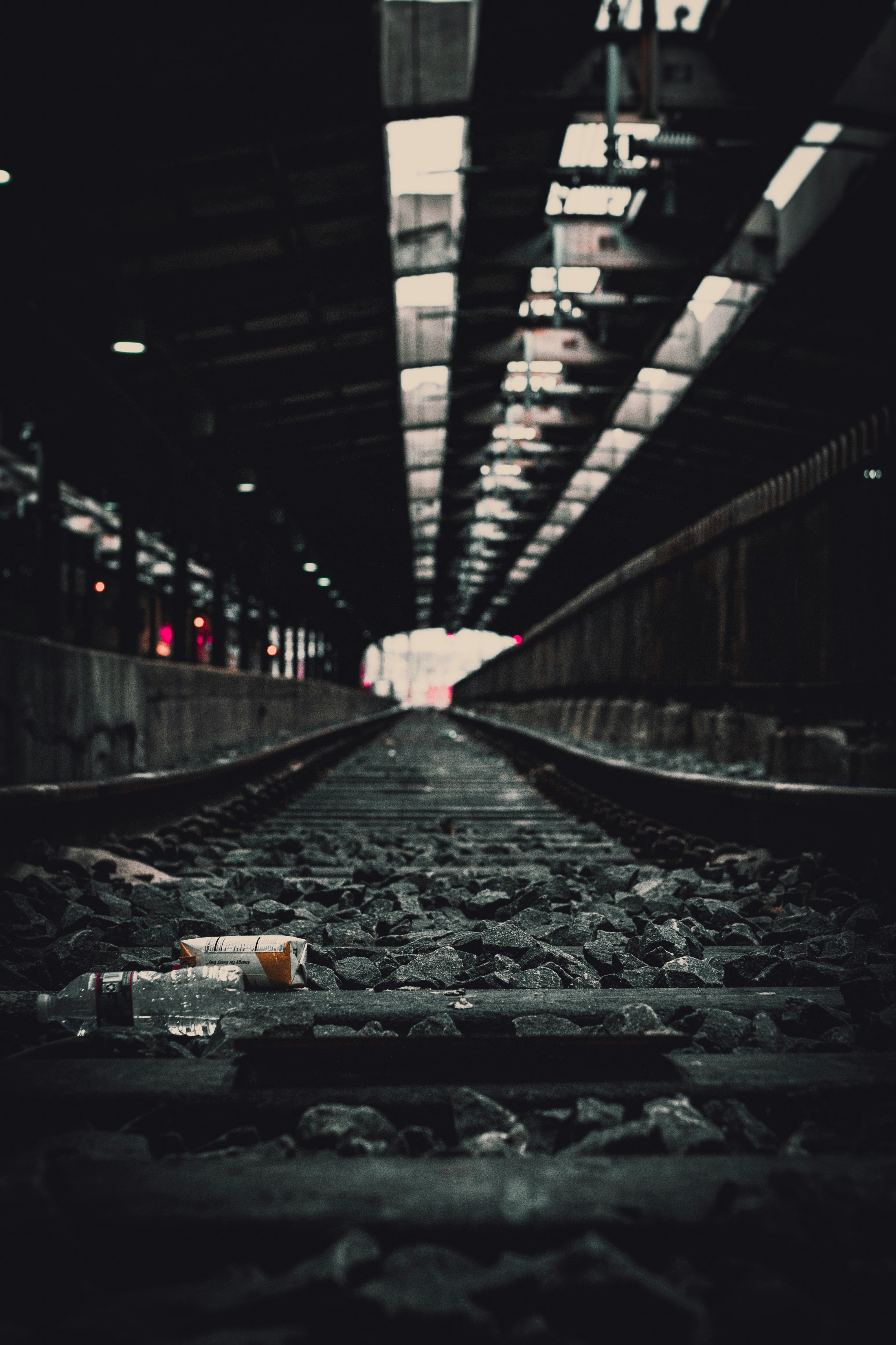 bottles on rail during daytime
