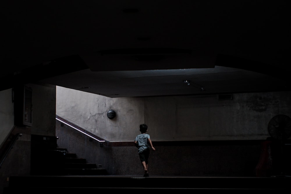 boy running near stair