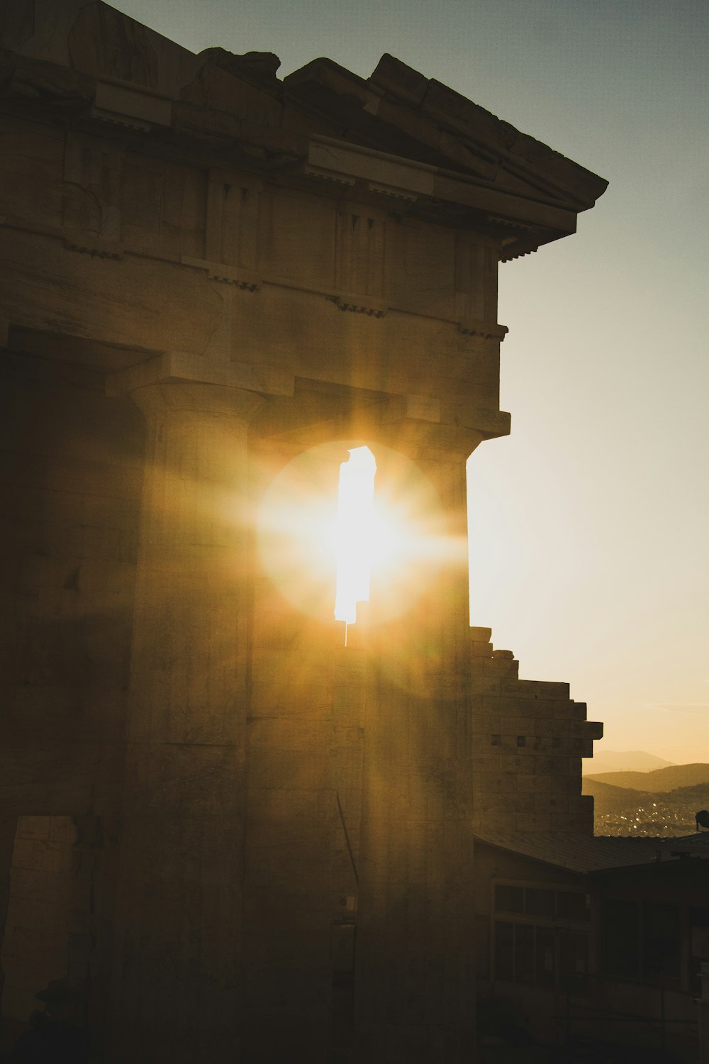 the sun shines brightly through the window of a building