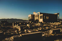 The majestic ruins of the ancient city of Balkh bathed in golden sunset light.