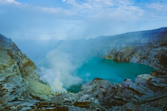body of water near mountain