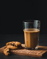 clear drinking glass and cookie