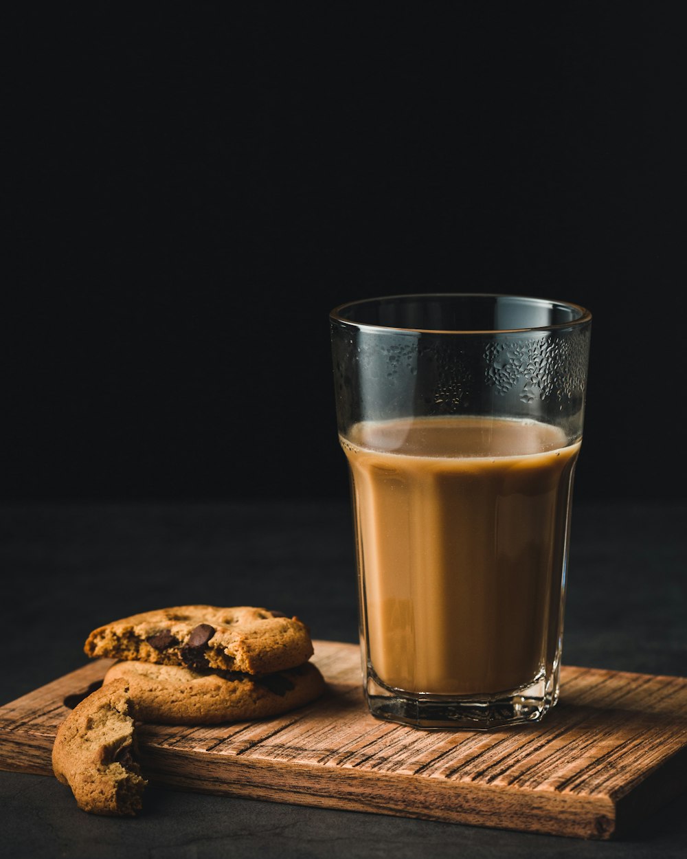 clear drinking glass and cookie