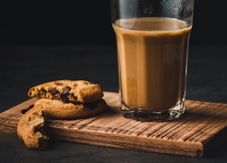 clear drinking glass and cookie