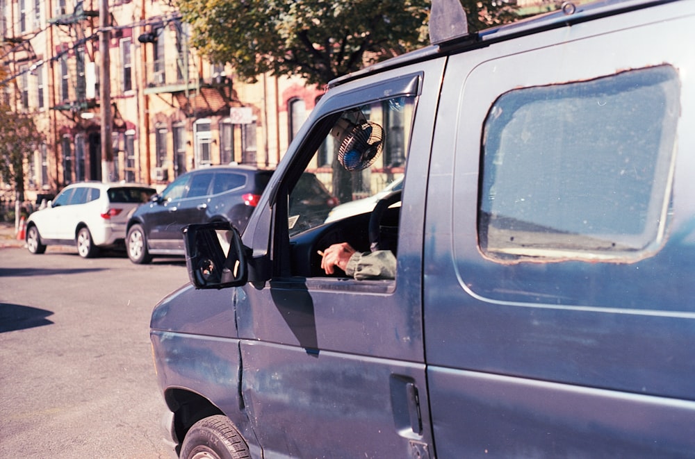 man driving van during daytime