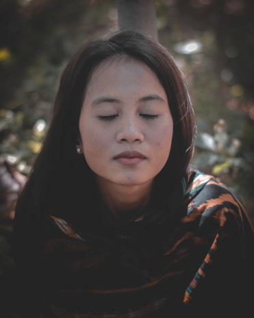 Portrait of Gabriella Dunia in a serene setting, radiating calm and wisdom.