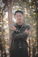 A serene photo of a person meditating with soft light filtering through trees, embodying peace and introspection.