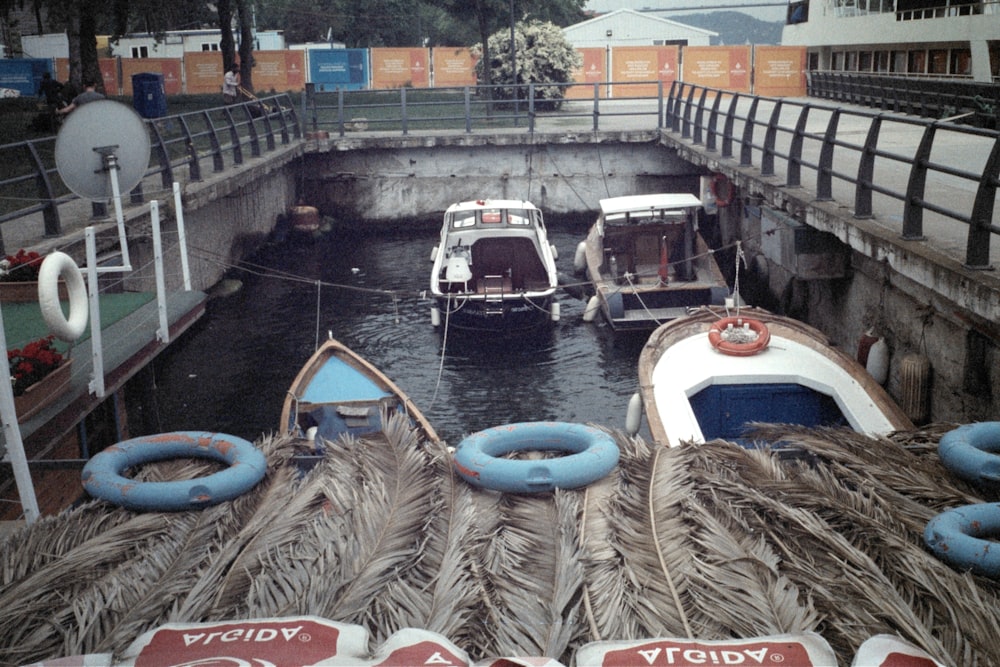 photography of white boat beside gray road